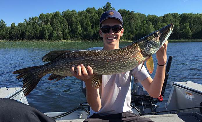 Teen Guest with Big Pike Catch